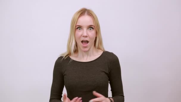 Confused Girl Holds Her Hands Wide. The Concept Of Shocked People - Footage, Video