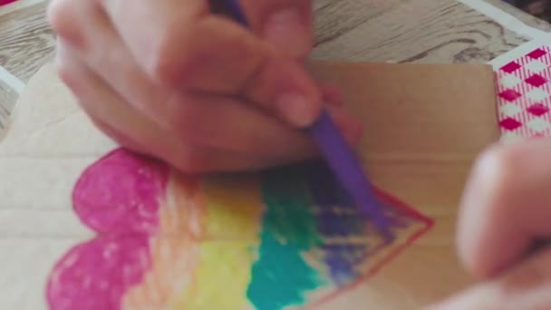 Pride day 2020. Female drawing rainbow flag on carton. Preparation placard with rainbow painting elements for annual LGBTQ march. LGBTQ Pride Festival 2020. Human rights, gender equality concepts - Footage, Video