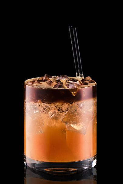 Espresso tonic with grapefruit juica isolated on black background - Photo, image