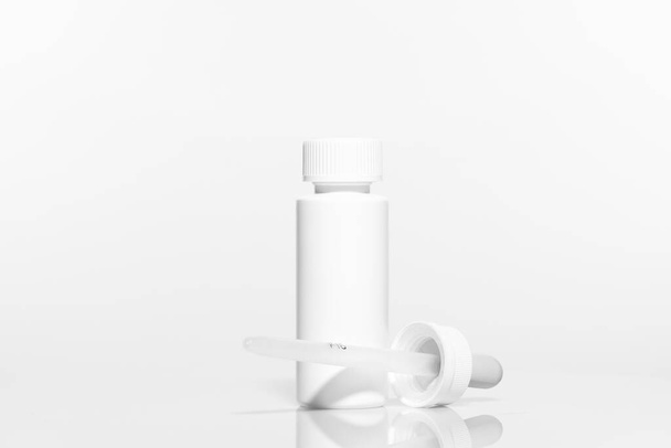 Blank plastic Bottle with Dropper Cap on white background. Plastic bottle Packaging Mockup set ready for your design. High-resolution photo. - Foto, Bild