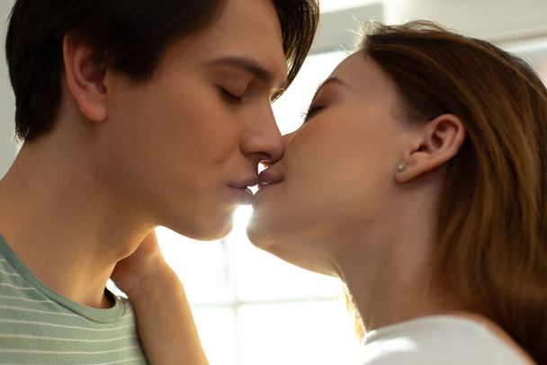 Romantic kiss of beautiful loving man and woman - Zdjęcie, obraz
