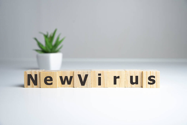 new virus word written on wood block. new virus text on wooden table for your design, coronavirus concept top view - 写真・画像