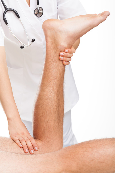 Orthopedist examining man's legs - Фото, зображення