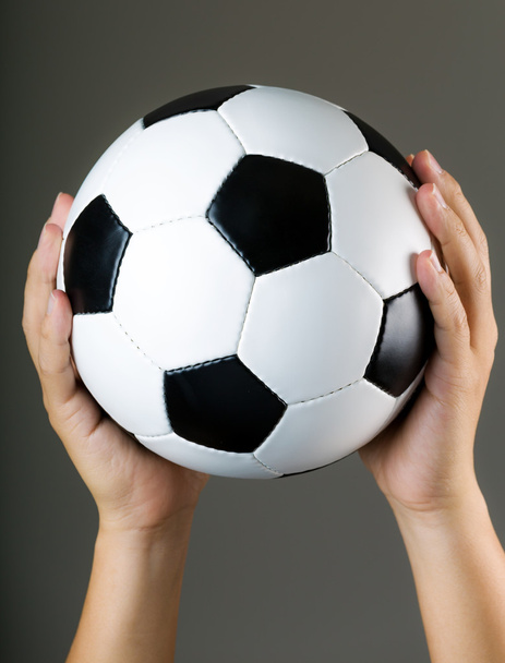 Hand holding soccer ball - Foto, afbeelding