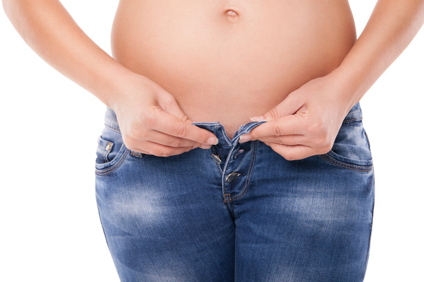 Pregnant belly; woman wearing jeans - 写真・画像