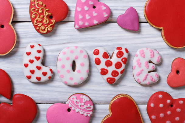 Gingerbread in the form of hearts and letters on a wooden - Фото, зображення