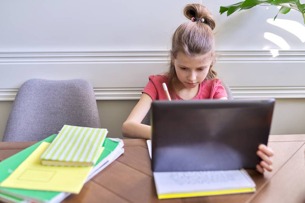 Girl child studying at home using digital tablet - Foto, Imagem