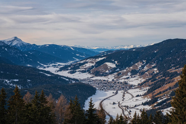 Winter landscape in Tre Cime Dolomiti, or Drei Zinnen Dolomites. Monte Elmo Sesto , Italy. January 2020. Top view on San Candido. - Photo, image