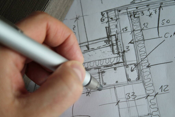 Architect designing freehand with his pencil - Photo, Image
