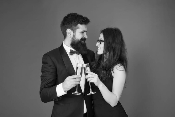Toast to love. Couple in love drink champagne. Sexy woman and bearded man raise glasses. Happy family celebrate Valentines day. Drink to love. Romantic relationship. Love always - Photo, Image