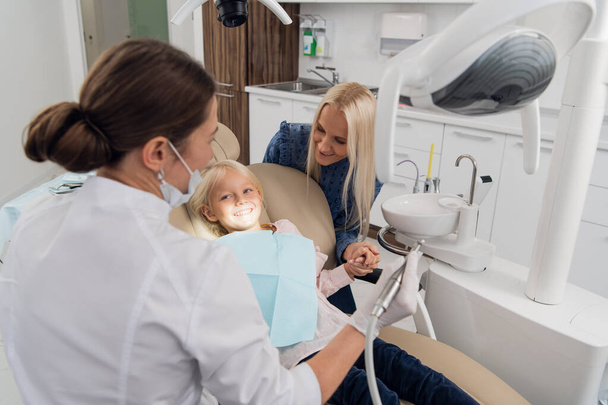 A child having a regular checkup at the dentists office - Фото, зображення