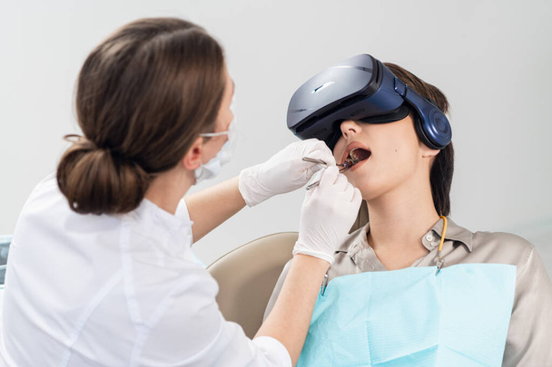 A close up picture of the process of modern dental treatment, wi - Photo, Image