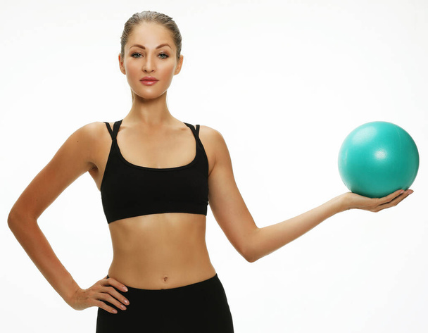 Athletic woman doing exercise with medicine ball. - Photo, image