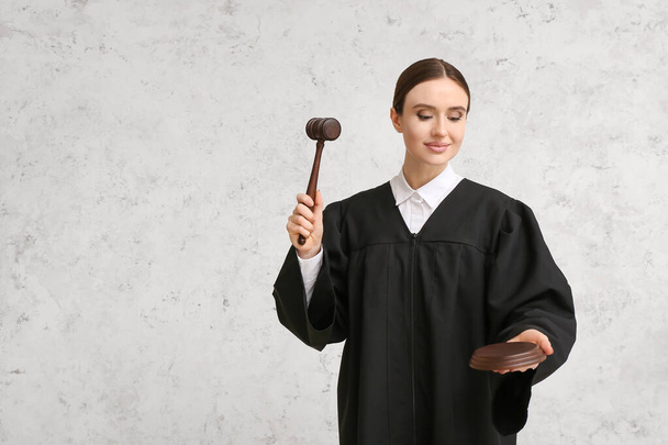 Female judge on light background - Foto, afbeelding