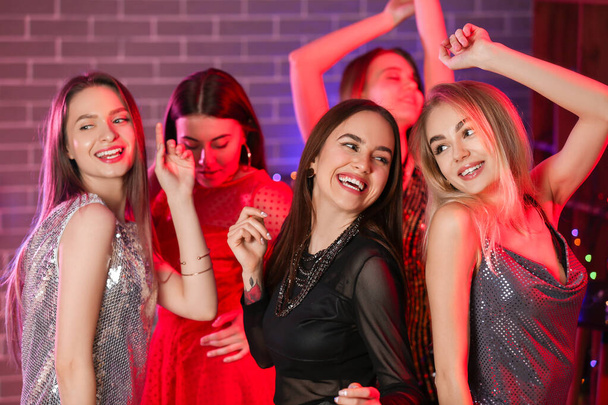 Beautiful young women dancing in night club - Φωτογραφία, εικόνα
