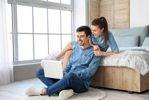 Young couple working together at home - Foto, imagen