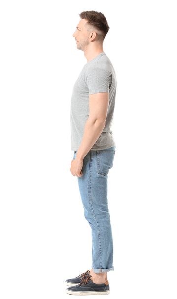 Man in stylish t-shirt on white background - Fotó, kép