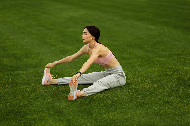 Young fit woman exercising on stadium  - Foto, Imagen