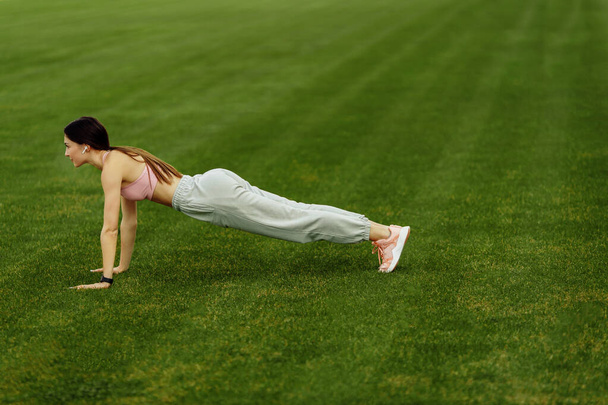 Young fit woman exercising on stadium  - Fotoğraf, Görsel