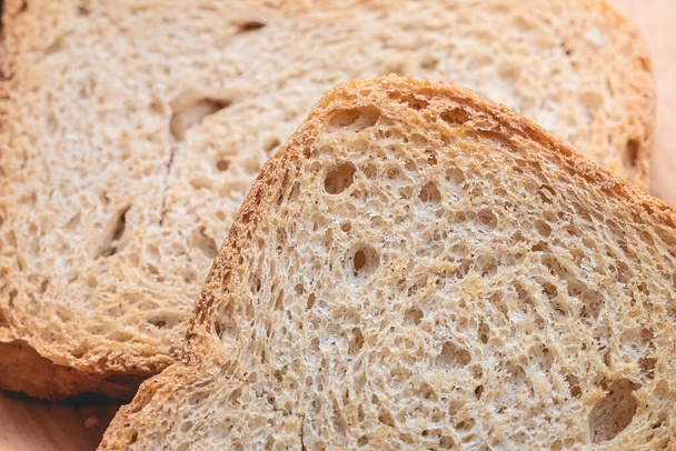 wholemeal toast ( torrada integral ) in close-up on a wooden board. - Φωτογραφία, εικόνα