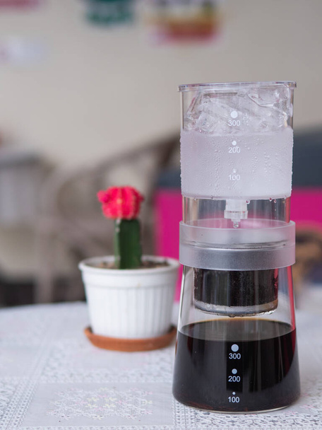 cold drip uses a simple steeping technique that helps highlight the natural chocolate, floral, and fruity notes inherent in coffee - Photo, Image