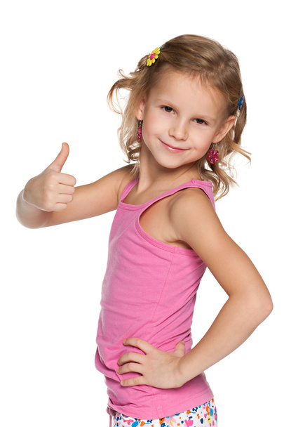Smiling girl with her thumb up - Photo, Image