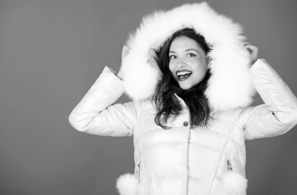 Ambitious and beautiful. seasonal fashion. happy winter holidays. its christmas. beauty in winter clothing. cold season shopping. woman in padded warm coat. girl in hood. faux fur fashion - Valokuva, kuva