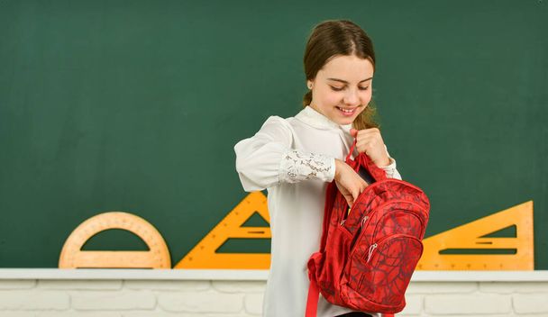 Clever teenager student. Educative activity. Child study in school. My backpack is just right. Smart schoolgirl. School education. Knowledge day. Girl in school classroom copy space. School project - Фото, зображення
