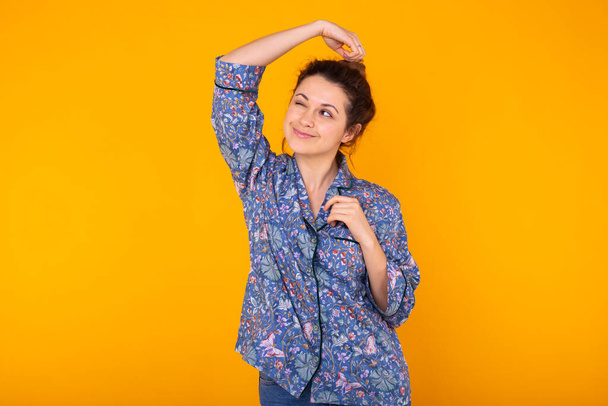 Fashion portrait pretty cool girl having fun over colorful yellow background. - Photo, Image