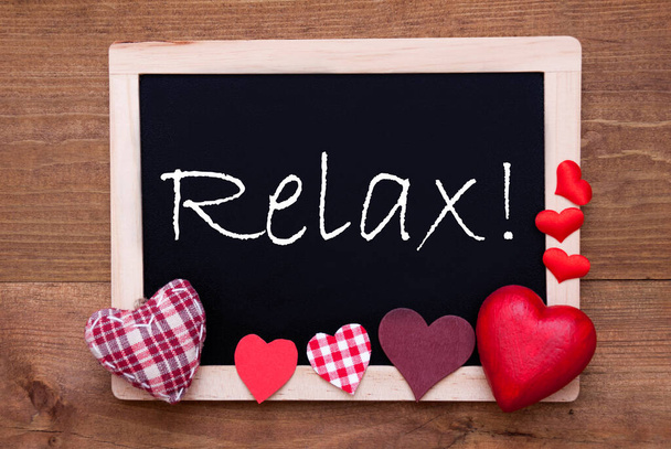 Balckboard With Red Heart Decoration, Text Relax, Wooden Background - Photo, Image