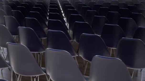 Empty chairs in the hall Empty movie theater Dark background Interior design. - Footage, Video