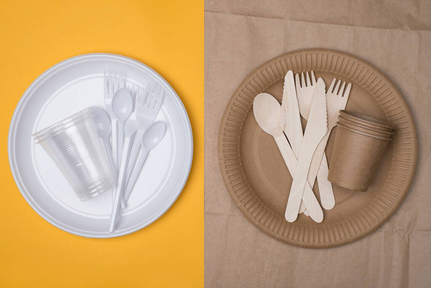 Choosing sustainable dinnerware concept. Top above overhead view photo of white plastic and wooden and paper utensils compared isolated on yellow and craft paper background - Photo, Image