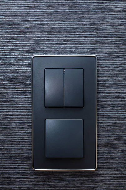 Modern belsőépítészeti részletek - fekete kapcsolók és elegáns tapéta. Kényelmes elegancia - Fotó, kép