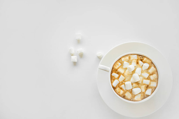 A Cup of coffee with marshmallow on a white background - Fotó, kép