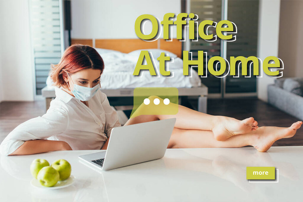 barefoot freelancer in medical mask working on laptop at home with apples on self isolation with office at home lettering - Fotografie, Obrázek