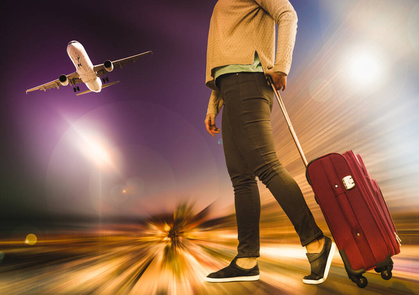 Woman carries luggage on airplane background with effect motion blur - Φωτογραφία, εικόνα