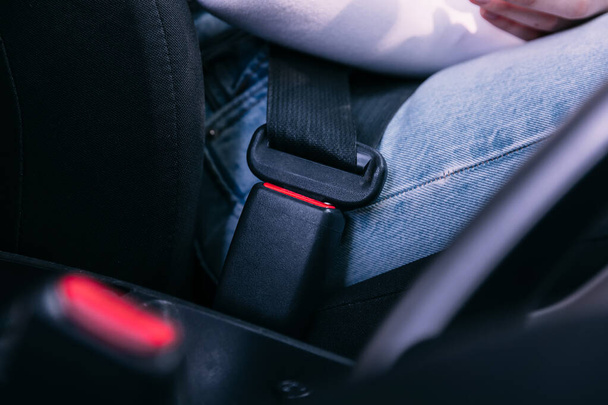 A seatbelt in a car with cloth seats - Photo, Image