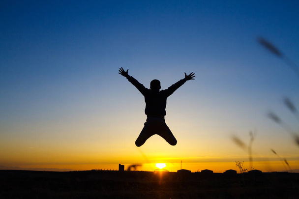 Successful businessman jumping his hands up - Photo, Image