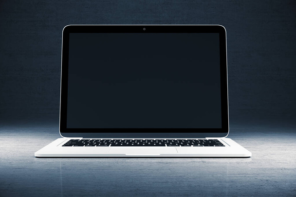 Modern designer desktop with blank black laptop screen on gray wall background. Mock up. 3D Rendering - Valokuva, kuva