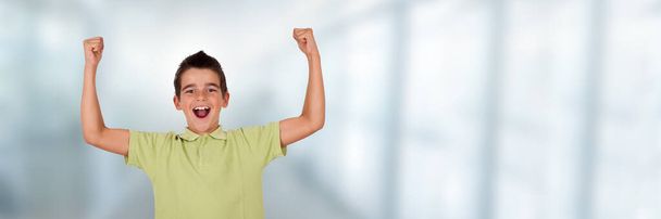 boy or student in college with arms raised celebrating success - Foto, imagen