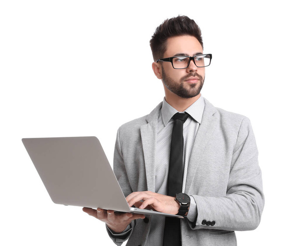 Young businessman with laptop on white background - Φωτογραφία, εικόνα