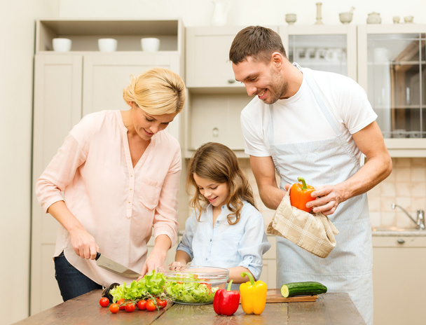 Happy family making dinner in kitchen - Photo, Image