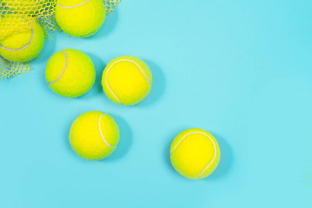 Tennis balls close up on blue tennis court.  - Fotoğraf, Görsel