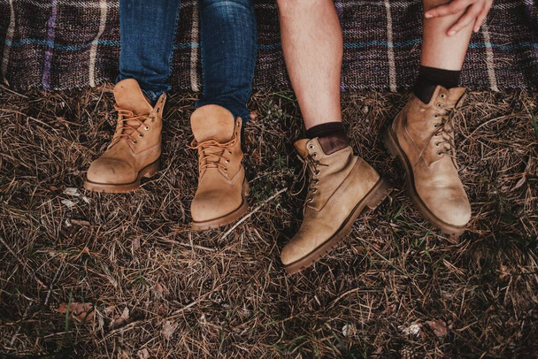  Walking with a pair of timberland boots - Φωτογραφία, εικόνα