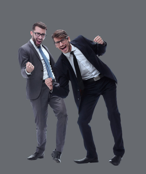 in full growth. two happy dancing young businessmen - Фото, изображение