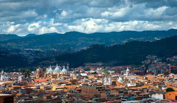 View of the city of Cuenca, with it 's many churches, cathedrals and houses, in the middle of the Ecuadorian Andes, on a sunny afternoon, Ecuador, South America
. - Фото, изображение
