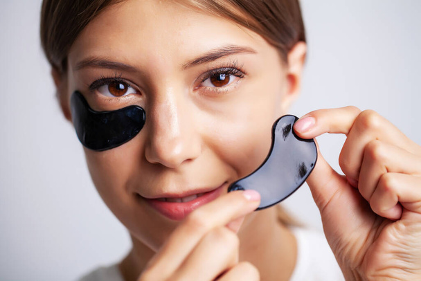 Eye patch, Beautiful Woman With Natural Makeup And Black Hydro Gel Eye Patches On Facial Skin - Photo, Image