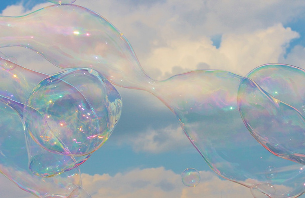 Soap bubbles on breeze in sky - Photo, Image