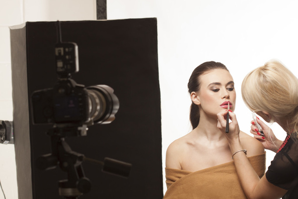 Beautiful model preparing for a photo shoot - Photo, Image
