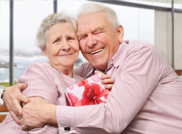 Smiling senior couple hugging - Фото, изображение